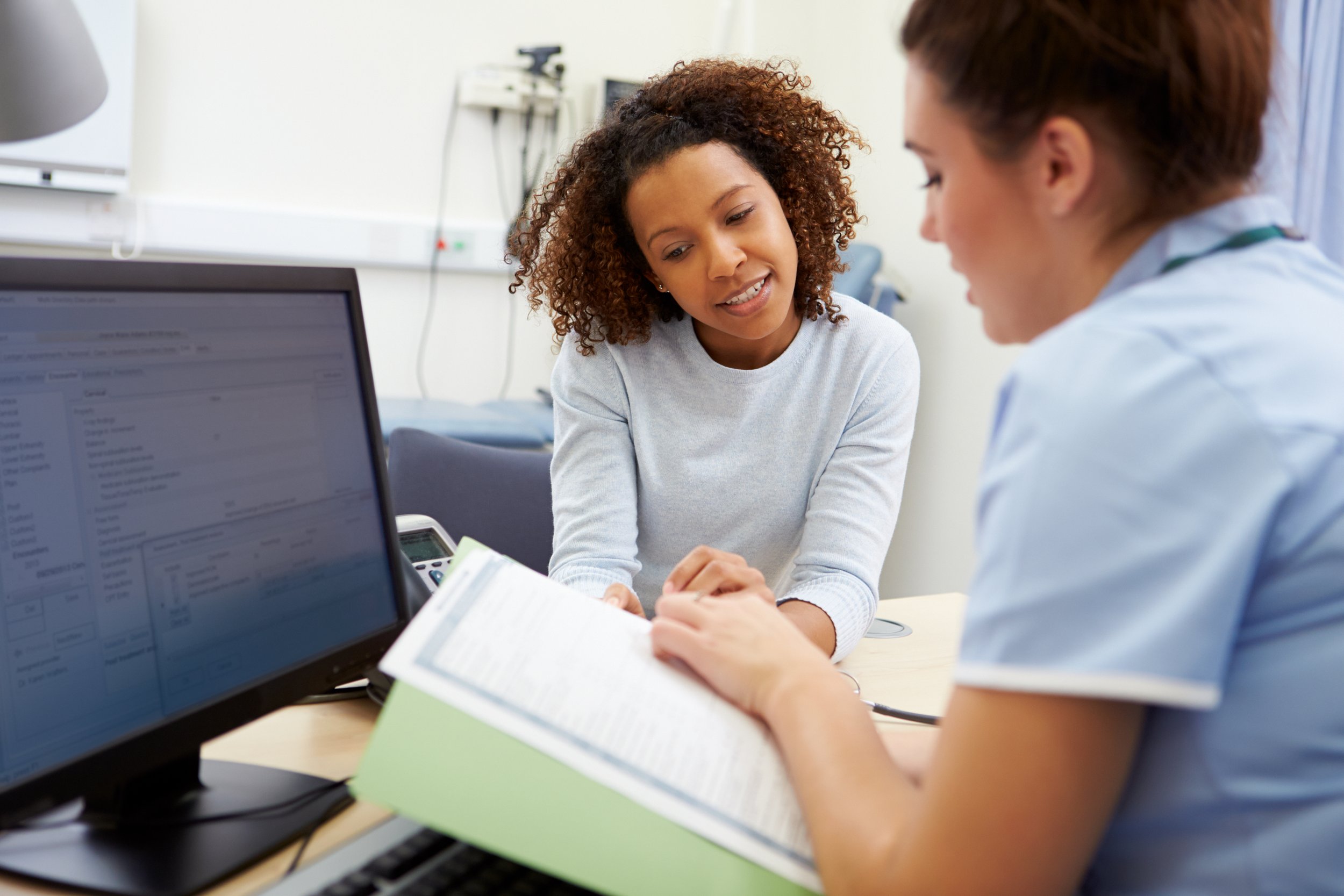 Patient and Doctor Talking At An Appointment
